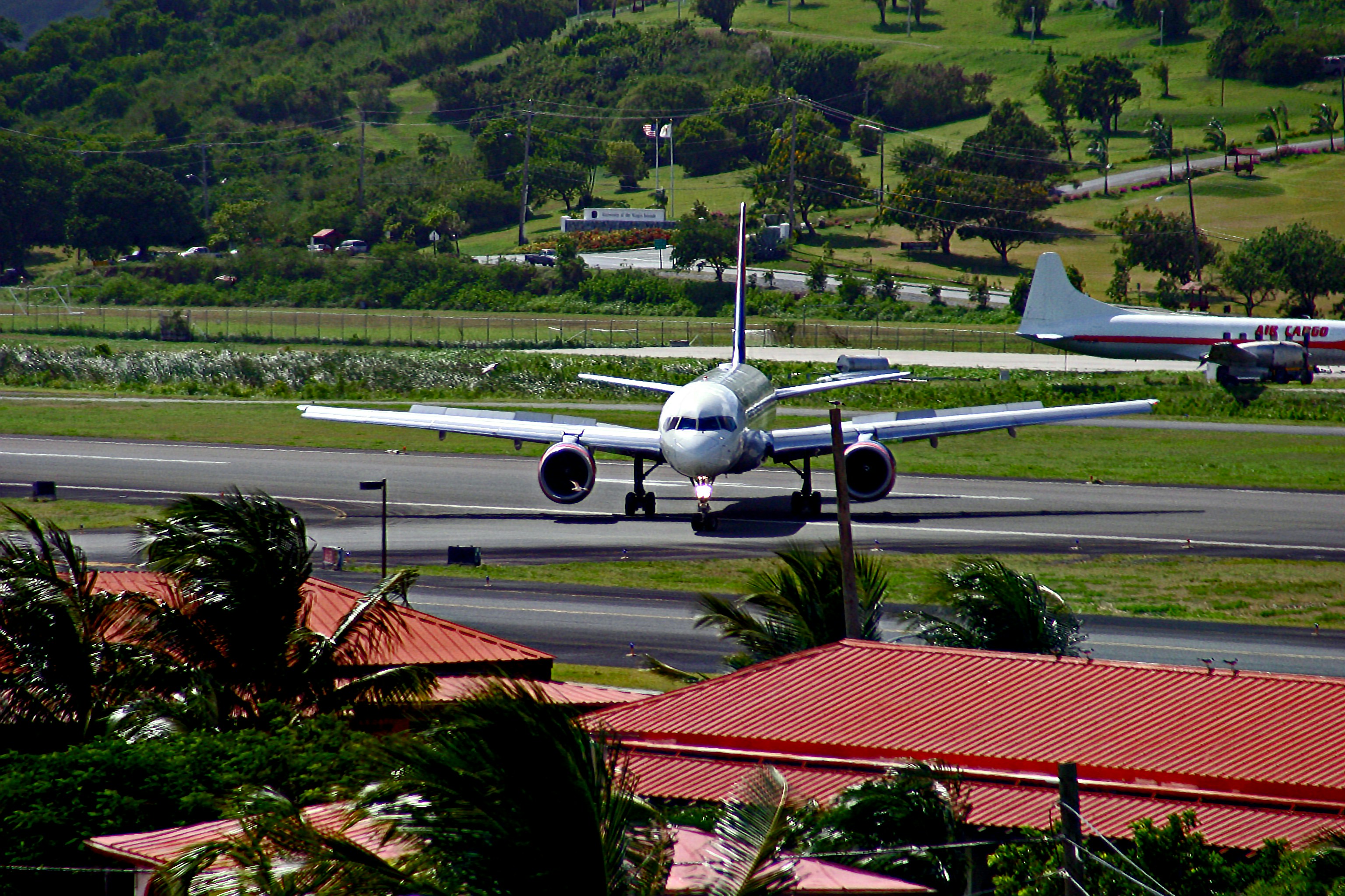 A jet taxiis on an airport runway.